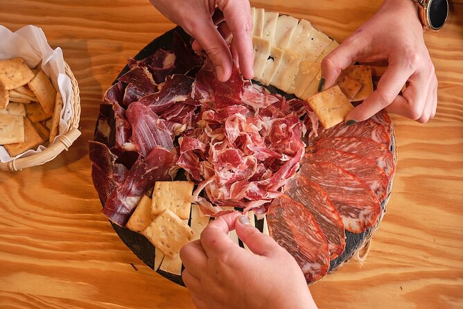 De Tapas in Malasaña: Evening Wine and Tapas Tour - Malasaña at Night: where the eating starts and the context clicks