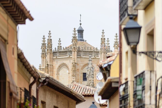 From Madrid: Full-Day Medieval Tour in Toledo and Ávila - What your $112 includes: bus ride, guide, and entry tickets