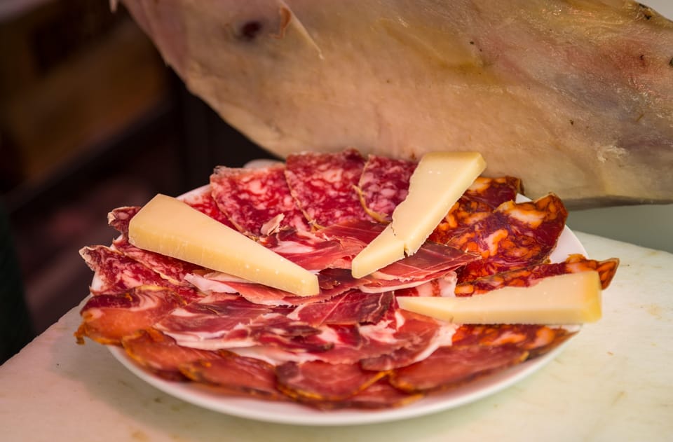 Madrid: Authentic Tapas Evening Tour with a side of History - Starting at Plaza Isabel II: Where Your Madrid Evening Gets Going