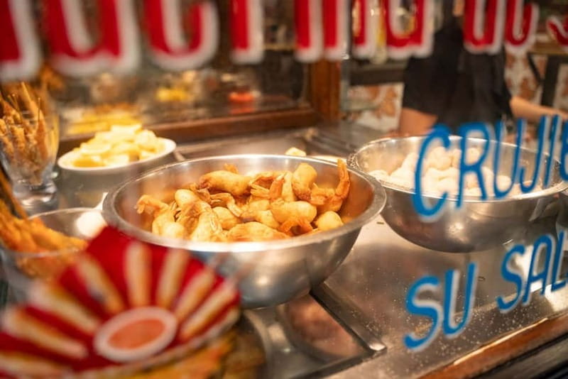 Madrid: Evening Tapas Tour with 5 Delicious Stops & Drinks - Stop 2: Mercado de San Miguel for Classic Market Energy