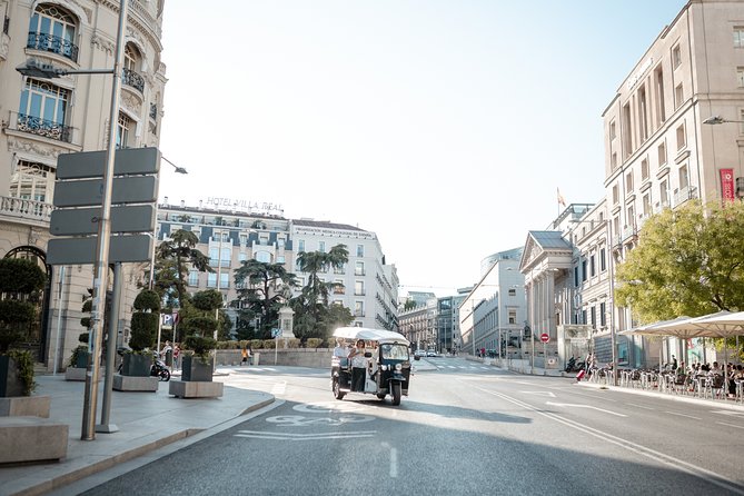 Madrid Express Tour with Local Guide in Eco Tuk Tuk Private - The food-market stop: a 1916 foundation for modern Madrid