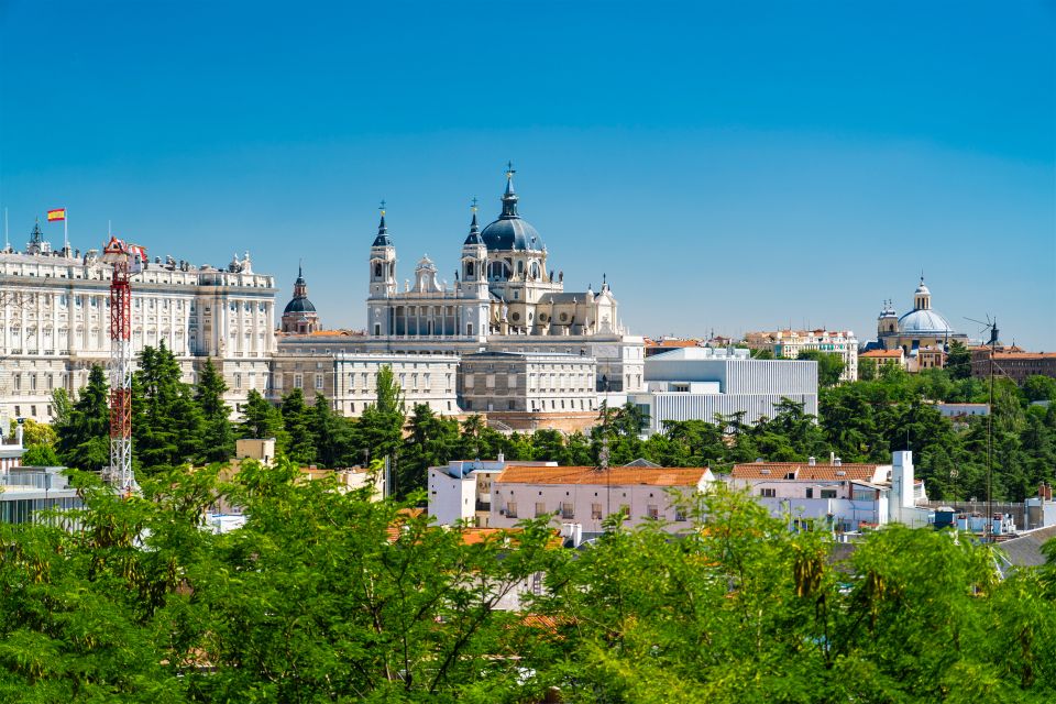 Madrid: Guided Highlights Walking Tour - Palacio Madrid and Almudena Cathedral: power in stone, faith in the foreground