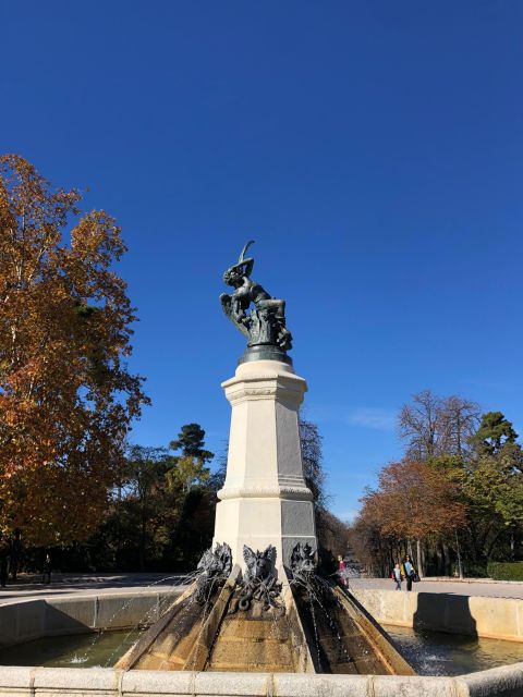 Madrid: Prado Avenue and Retiro Park Guided Walking Tour - Entering Retiro Park: gardens, pond embankment, and the royal-era vibe