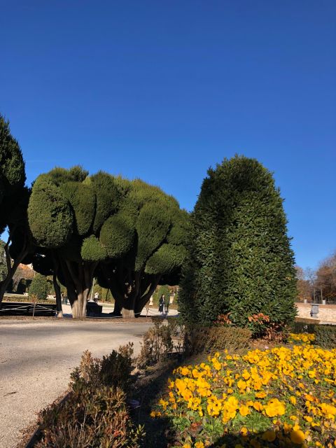 Madrid: Prado Avenue and Retiro Park Guided Walking Tour - Crystal Palace: more than a pretty structure