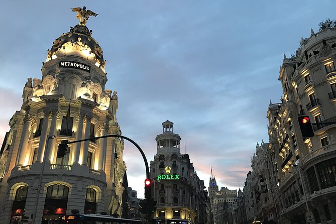 Madrid Sunset Walking Tour with Optional Flamenco Show and Dinner - Gran Vía’s night energy: shops, theaters, and people