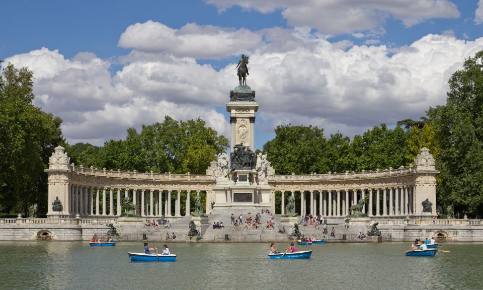 Private Madrid Highlights Walking Tour - Puerta de Alcalá: walking under a symbol, not just past a gate