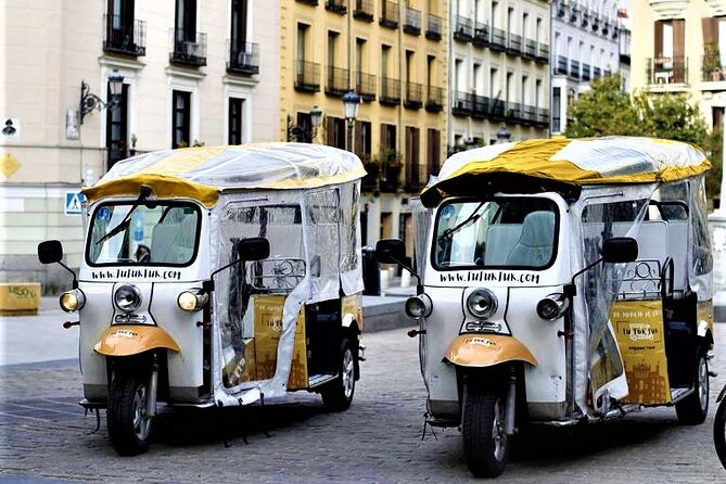 Tour of Historic and Modern Madrid with a guide in a yellow tuk tuk - Madrid Cathedral, a gastronomy stop, and the Cervantes-to-Congress storyline